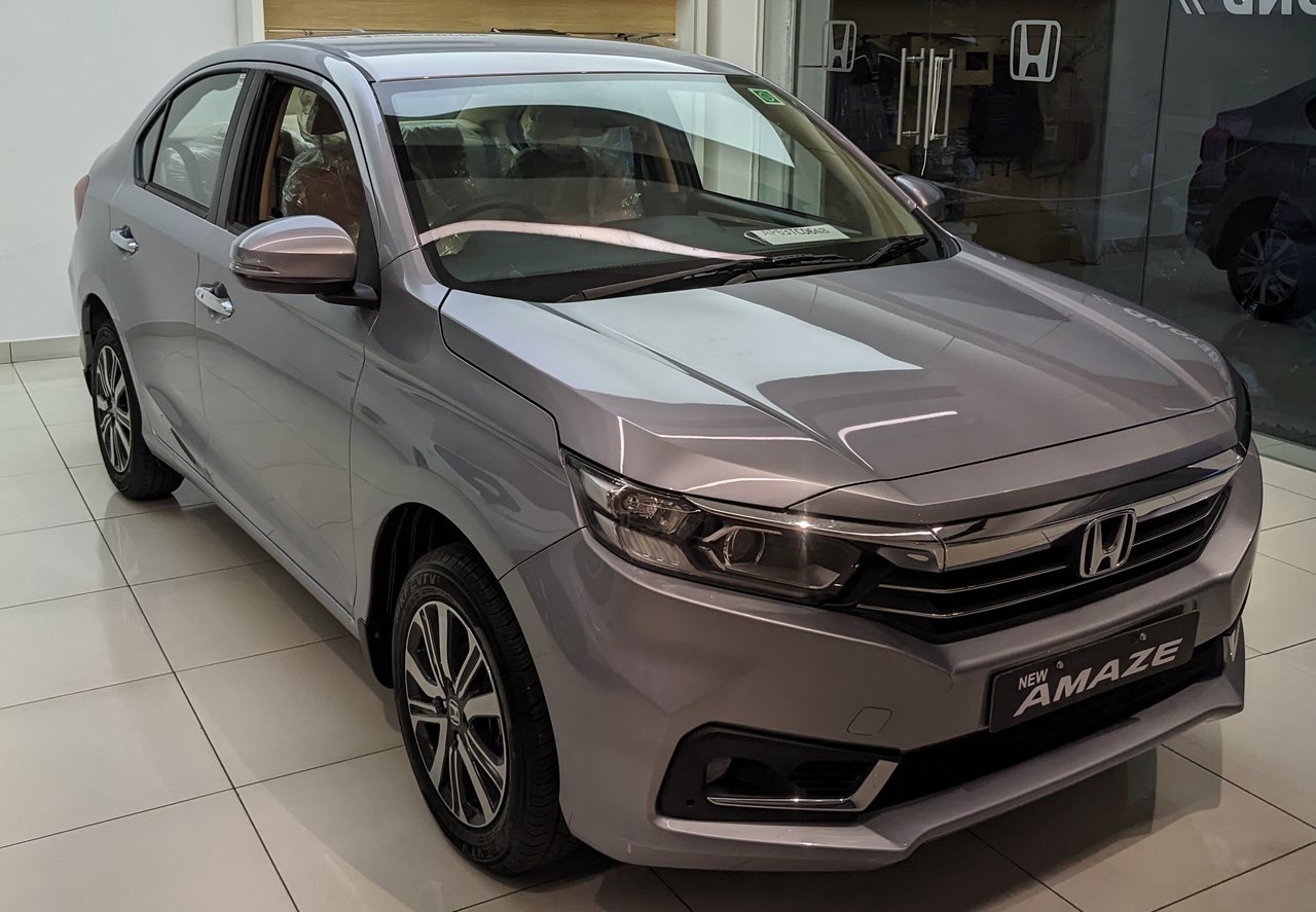 India-spec Honda Amaze second-generation facelift (2021), Lunar Silver, front three-quarter in showroom