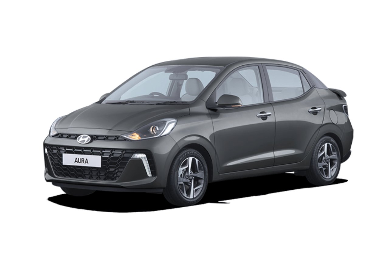 Current India-spec Hyundai Aura facelift in Titan Grey, front three-quarter studio