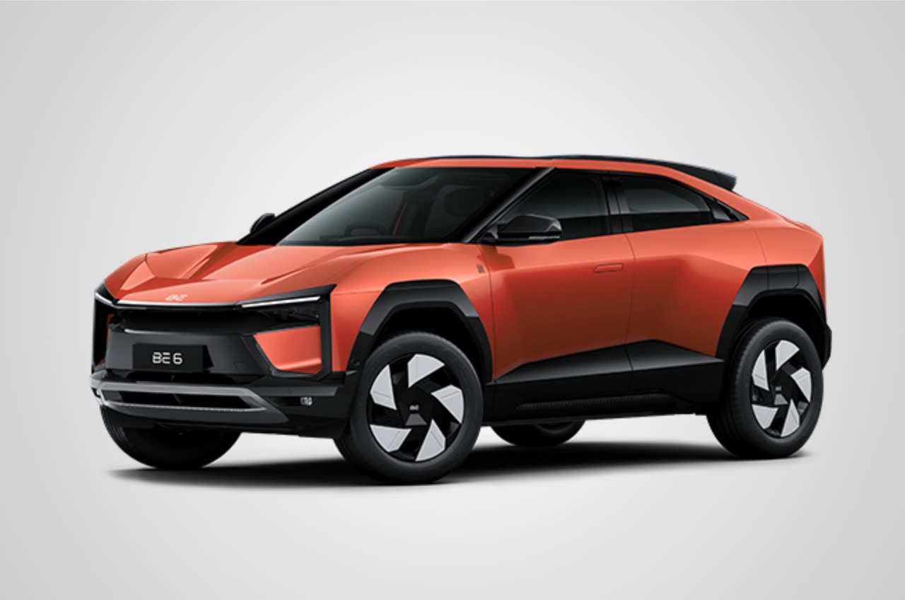 Current India-spec Mahindra BE 6 in Firestorm Orange, front three-quarter studio