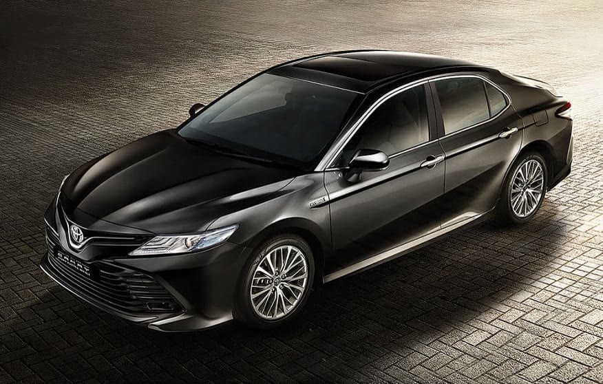 Original India-spec Toyota Camry XV70 hybrid (2019–2022), dark metallic, OEM press front three-quarter