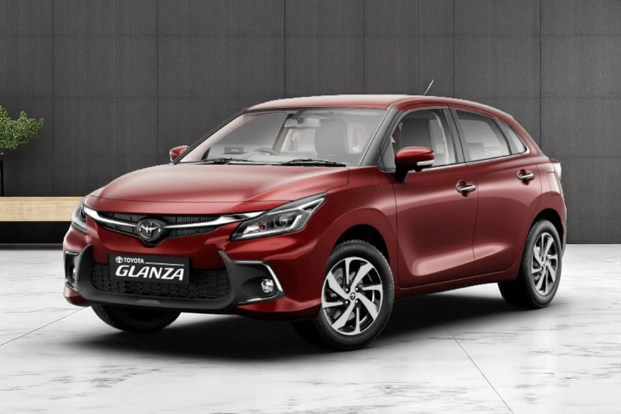 Current India-spec Toyota Glanza second generation in Sportin Red, front three-quarter studio