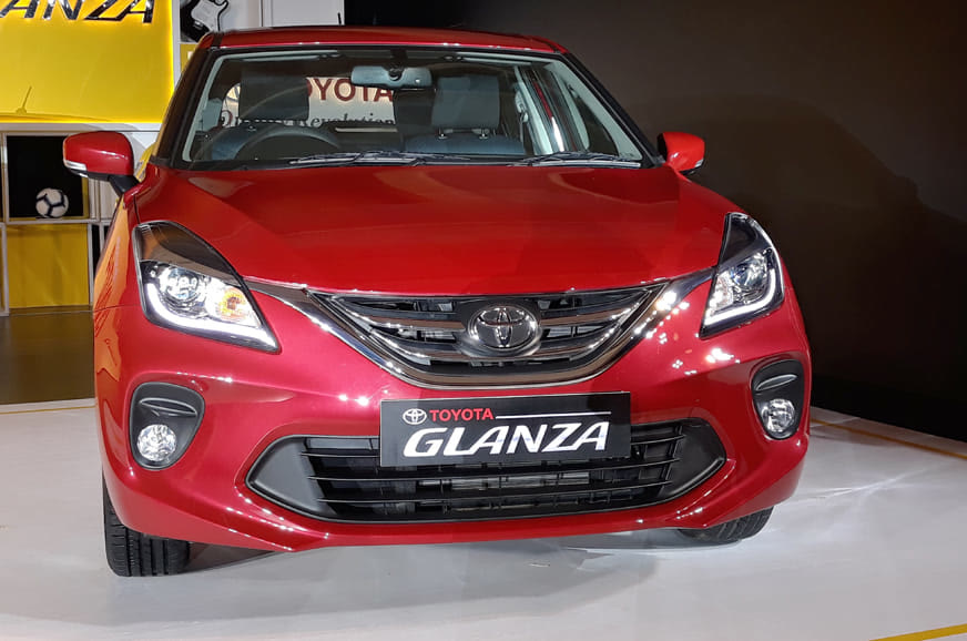 Original India-spec Toyota Glanza first generation (2019–2022), Sportin Red, OEM press front three-quarter