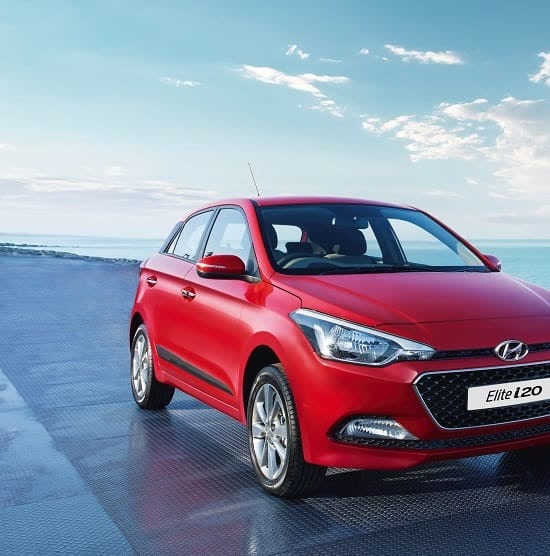 Original India-spec Hyundai Elite i20 (2014 pre-facelift), red, official-press front three-quarter