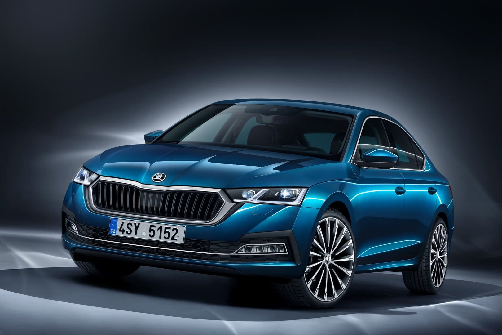 Original India-bound Skoda Octavia NX (2021 pre-facelift Style/L&K), Lava Blue, OEM press front three-quarter