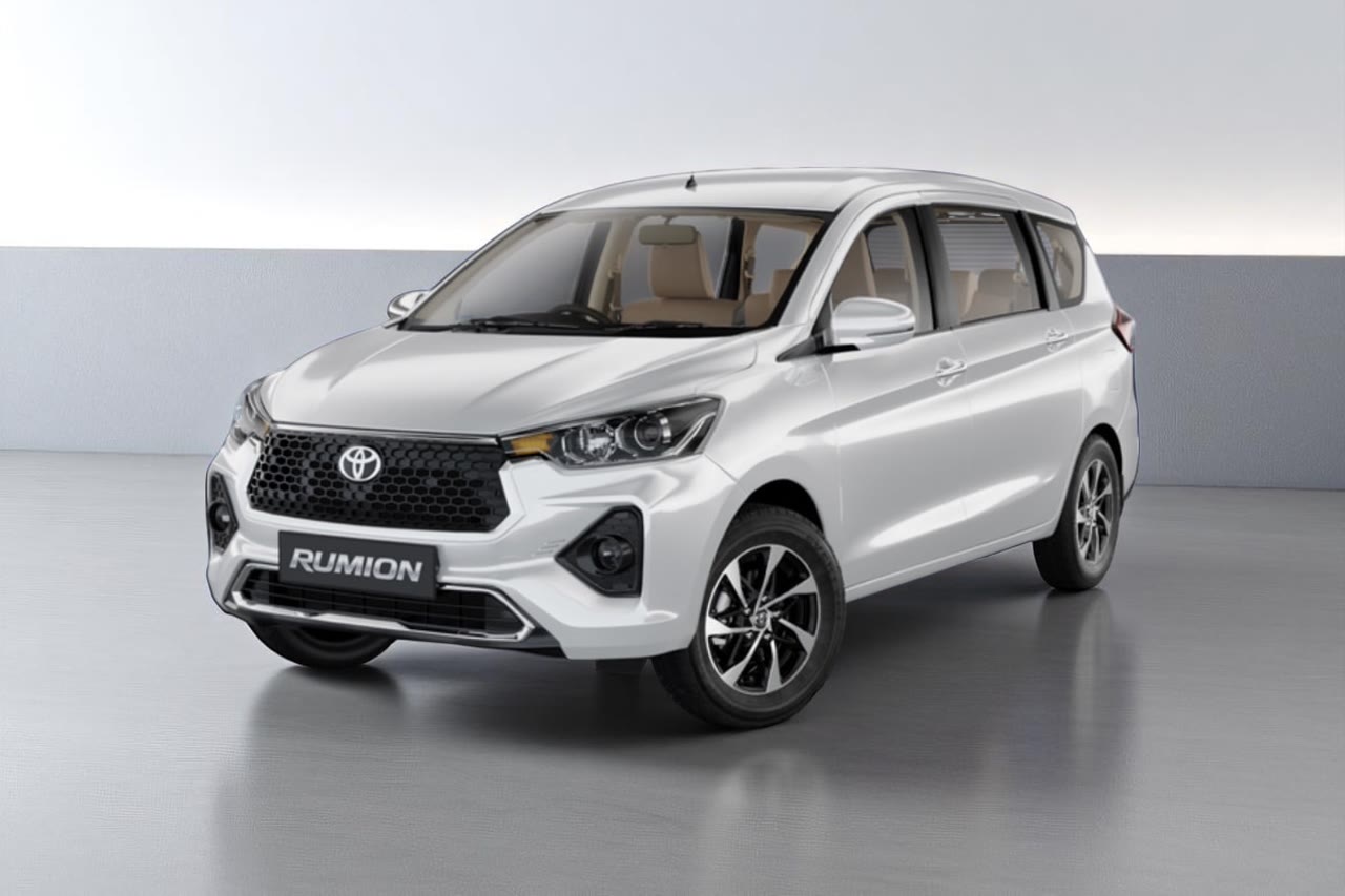 Current India-spec Toyota Rumion in Cafe White, front three-quarter studio