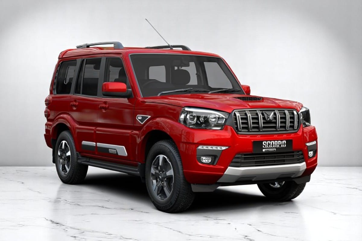 Current India-spec Mahindra Scorpio Classic in Red Rage, Twin Peaks grille, front three-quarter studio