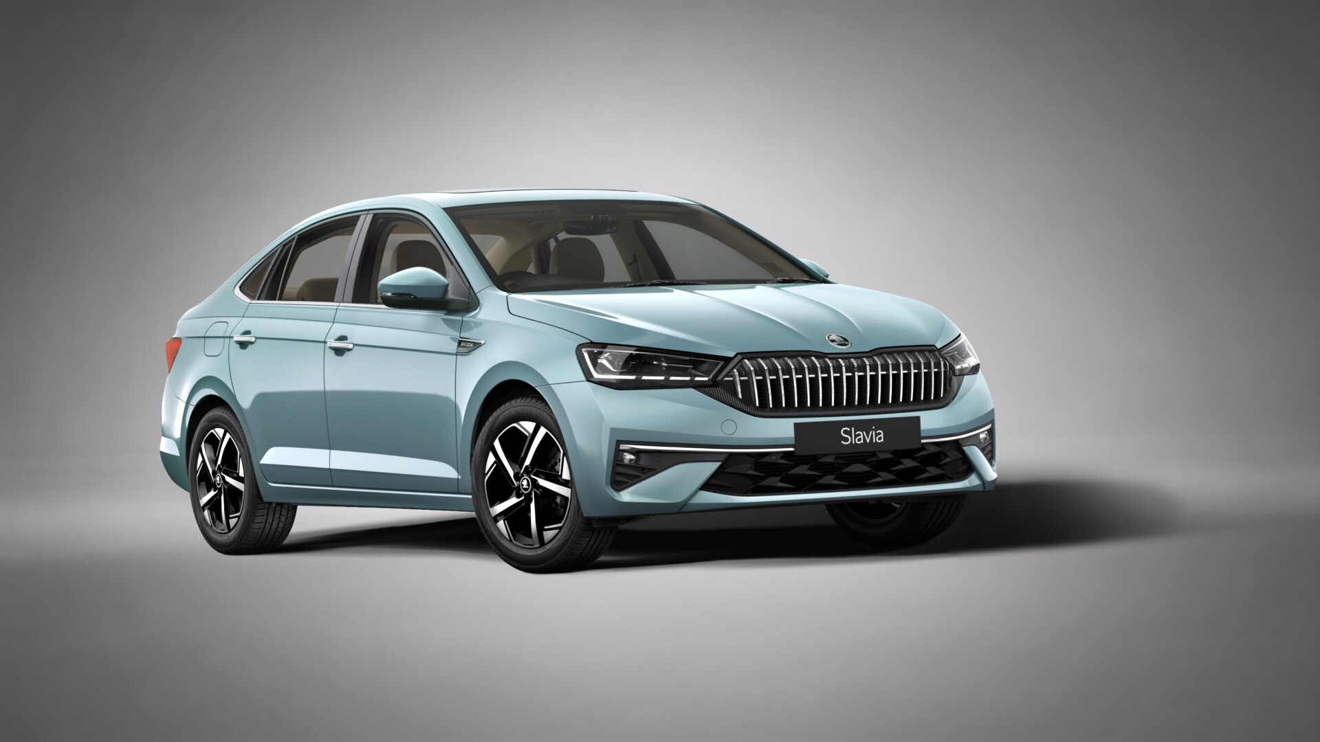Current India-spec Skoda Slavia facelift, Lava Blue, front three-quarter studio