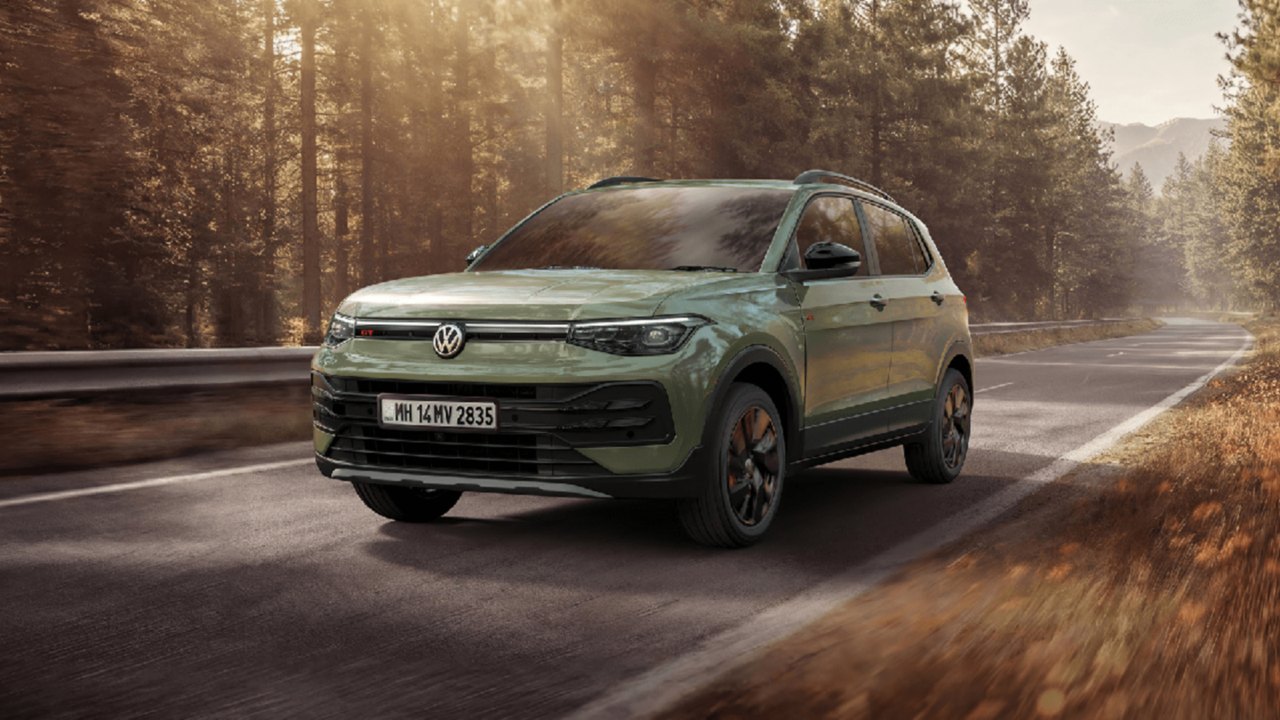 Current India-spec Volkswagen Taigun facelift GT, sage green, front three-quarter press shot