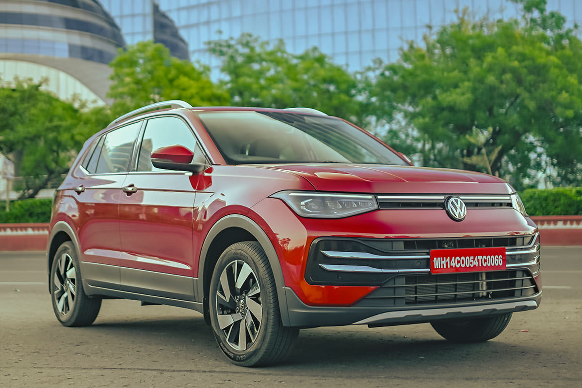 Original India-spec Volkswagen Taigun (2021–2026), Wild Cherry Red, OEM press front three-quarter