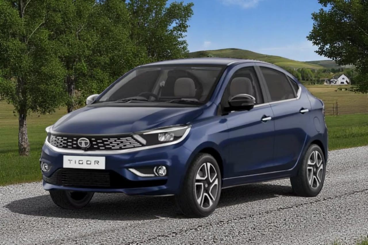 Current India-spec Tata Tigor in Arizona Blue, front three-quarter official press