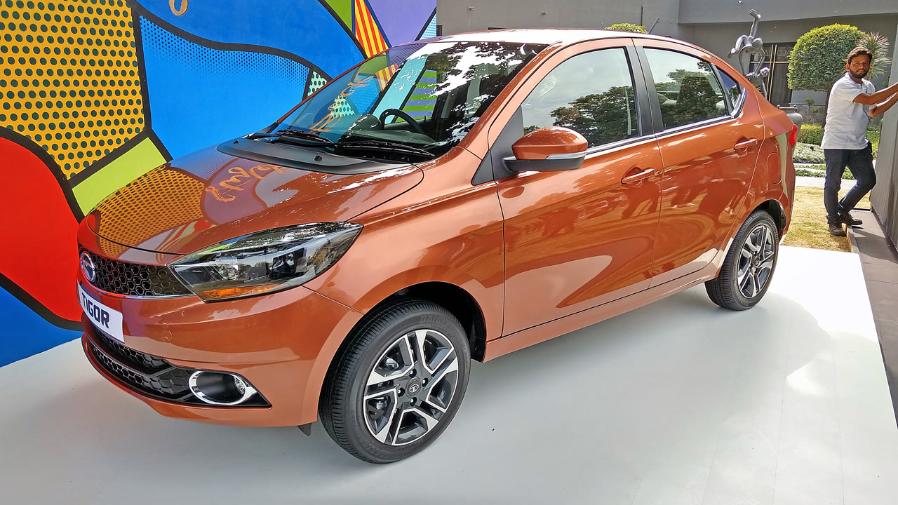 Original India-spec Tata Tigor StyleBack (2017 pre-facelift), copper, OEM press front three-quarter